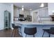 Bright kitchen with stainless appliances, granite countertops, and breakfast bar with seating at 5620 Berney Cir, Powder Springs, GA 30127
