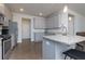 Well-lit kitchen featuring stainless steel appliances, granite countertops, and bar stool seating at 5620 Berney Cir, Powder Springs, GA 30127