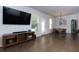 Open concept living and dining area with hardwood floors and modern decor at 5620 Berney Cir, Powder Springs, GA 30127