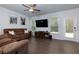 Bright living room with hardwood floors and a walk-out to the back at 5620 Berney Cir, Powder Springs, GA 30127