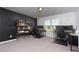 Spacious office space with a dark accent wall and dual monitor setup at 5620 Berney Cir, Powder Springs, GA 30127