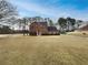 Charming two-story brick home with a well-maintained front yard and mature trees at 7782 Wethersfield Dr, Jonesboro, GA 30236