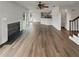 Open-concept living area with fireplace and view of kitchen at 7782 Wethersfield Dr, Jonesboro, GA 30236