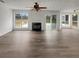 Spacious living room with fireplace, large windows and neutral decor at 7782 Wethersfield Dr, Jonesboro, GA 30236