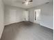 Serene bedroom featuring a tray ceiling, soft lighting, and neutral decor at 7782 Wethersfield Dr, Jonesboro, GA 30236