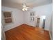 Comfortable bedroom featuring gleaming hardwood floors, a ceiling fan, and ample natural light at 1191 Beechview Se Dr, Atlanta, GA 30316