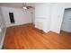 Bright living room featuring hardwood floors, a ceiling fan, and a decorative fireplace mantel at 1191 Beechview Se Dr, Atlanta, GA 30316