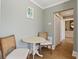 Cozy dining area with hard wood floors and access to the kitchen and hallway at 301 10Th Ne St # 15, Atlanta, GA 30309