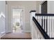 View of the hallway showing stairs and doorway leading to a living space with bright lighting at 301 10Th Ne St # 15, Atlanta, GA 30309