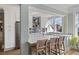 Bright, modern kitchen with stainless steel appliances, grey subway tile, and seating at the peninsula at 301 10Th Ne St # 15, Atlanta, GA 30309