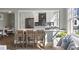Bright, modern kitchen with stainless steel appliances, grey subway tile, and seating at the peninsula at 301 10Th Ne St # 15, Atlanta, GA 30309