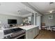 Open concept kitchen and living room with stainless steel appliances, hard wood floors, and a grey color palette at 301 10Th Ne St # 15, Atlanta, GA 30309