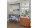 Charming home office nook with a vintage desk, gold mirror, and serene artwork at 301 10Th Ne St # 15, Atlanta, GA 30309