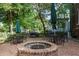 Outdoor brick patio with a fire pit, seating, and a grill at 301 10Th Ne St # 15, Atlanta, GA 30309