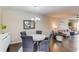 Inviting dining area featuring an elegant chandelier, complemented by rich dark wood floors and an open layout at 4288 Buford Valley Way, Buford, GA 30518