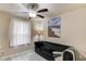 Comfortable living room with a dark sofa, ocean art, and a large window at 4288 Buford Valley Way, Buford, GA 30518
