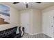 Bright living room featuring a modern sofa, a beach art and two doors at 4288 Buford Valley Way, Buford, GA 30518