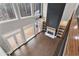 Open living room with high ceilings, fireplace, shelving, hardwood floors, and French doors at 1066 Fairway Valley Dr, Woodstock, GA 30189