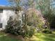 Exterior with blooming pink azalea for a touch of color and elegance to the property's landscape at 1405 Roper Rd, Canton, GA 30115