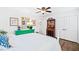 Cozy bedroom with natural light, wood floors, and ample closet space at 1405 Roper Rd, Canton, GA 30115