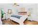 Comfortable bedroom featuring white walls, wood floors, and a cozy bed at 1405 Roper Rd, Canton, GA 30115