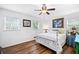 Bright bedroom with white walls, hardwood floors, and natural light from large windows at 1405 Roper Rd, Canton, GA 30115