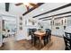 Bright dining room with wooden floors, farmhouse decor, and a lovely fireplace at 1405 Roper Rd, Canton, GA 30115