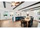 Open concept dining room showcasing hardwood floors and white cabinetry at 1405 Roper Rd, Canton, GA 30115