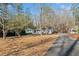 Exterior view of house from driveway with covered front porch at 1405 Roper Rd, Canton, GA 30115