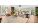 Bright living room featuring a ceiling fan, neutral decor, and wood floors at 1405 Roper Rd, Canton, GA 30115
