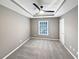 Another bedroom highlighting a tray ceiling and a window offering natural light at 2708 Stockbridge Way, Dacula, GA 30019