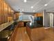 Well-equipped kitchen with stainless steel appliances, granite countertops, and wooden cabinets at 2708 Stockbridge Way, Dacula, GA 30019