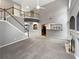 Bright living room featuring a fireplace, a large window, and open floor plan at 2708 Stockbridge Way, Dacula, GA 30019