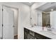 Elegant bathroom featuring a double sink vanity, white countertops, and modern fixtures at 1733 Hyssop Blvd, Mableton, GA 30126