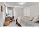 Bedroom with a neutral color palette and a view of the desk and double door closet at 1733 Hyssop Blvd, Mableton, GA 30126