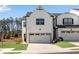Modern two-story home with a white brick exterior and a spacious two-car garage at 1733 Hyssop Blvd, Mableton, GA 30126