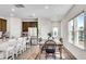 Bright open kitchen-dining area with stainless appliances and a large island with seating at 1733 Hyssop Blvd, Mableton, GA 30126