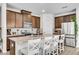 Spacious kitchen with dark wood cabinets, a central island, and stainless steel appliances at 1733 Hyssop Blvd, Mableton, GA 30126