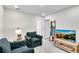 Cozy living room with comfortable seating, neutral walls, and lots of natural light at 1733 Hyssop Blvd, Mableton, GA 30126
