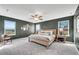 Spacious primary bedroom with natural light, neutral tones, and a ceiling fan at 1733 Hyssop Blvd, Mableton, GA 30126