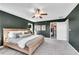 Tranquil main bedroom showcasing closet, soft carpet and a ceiling fan at 1733 Hyssop Blvd, Mableton, GA 30126
