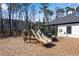 Community playground with slide, mulch, and nearby clubhouse in view at 1733 Hyssop Blvd, Mableton, GA 30126