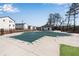 Community pool closed with a winter cover, clubhouse and townhomes in background at 1733 Hyssop Blvd, Mableton, GA 30126