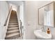 Hallway view of powder room with sink and stairway to the second floor at 1733 Hyssop Blvd, Mableton, GA 30126