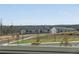 Community view of townhomes with skyline on the horizon at 1733 Hyssop Blvd, Mableton, GA 30126