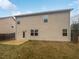 Back exterior of home with a patio and fenced backyard at 1260 Brookstone Cir, Conyers, GA 30012