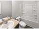 Clean bathroom with a shower-tub combo and white fixtures at 1260 Brookstone Cir, Conyers, GA 30012