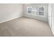 Large bedroom with carpeted floors and three windows allowing for lots of light at 1260 Brookstone Cir, Conyers, GA 30012