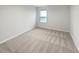 Clean and bright carpeted bedroom with a large window allowing ample natural light at 1260 Brookstone Cir, Conyers, GA 30012