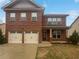 Charming two-story brick home with a two-car garage and well-maintained front yard at 1260 Brookstone Cir, Conyers, GA 30012